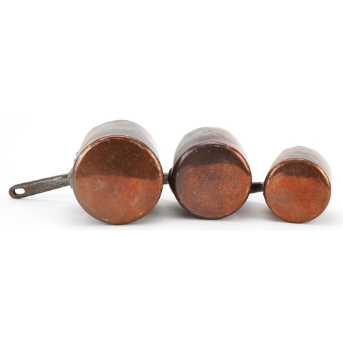 232 - Three 19th century copper saucepans by Jones Bros, Downing Street, the largest 24.5cm in length