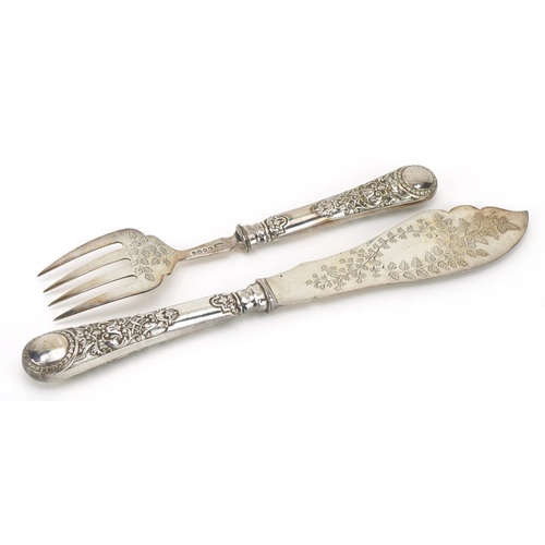 324 - Pair of Victorian silver fish servers, the blades engraved with vines, S S maker's mark London 1883,... 