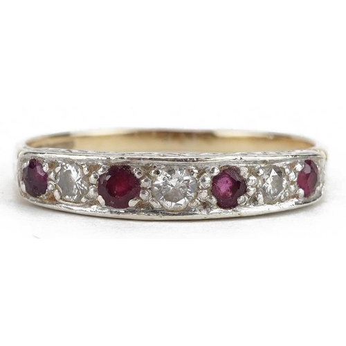 2052 - 9ct gold ruby and diamond seven stone ring, the largest diamond approximately 2.5mm in diameter, siz... 