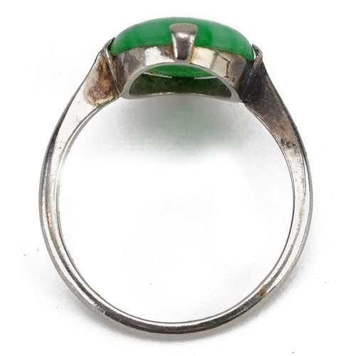 2025 - 18ct white gold cabochon jade solitaire ring, the jade approximately 14.5mm x 10.0mm, size N, 3.3g