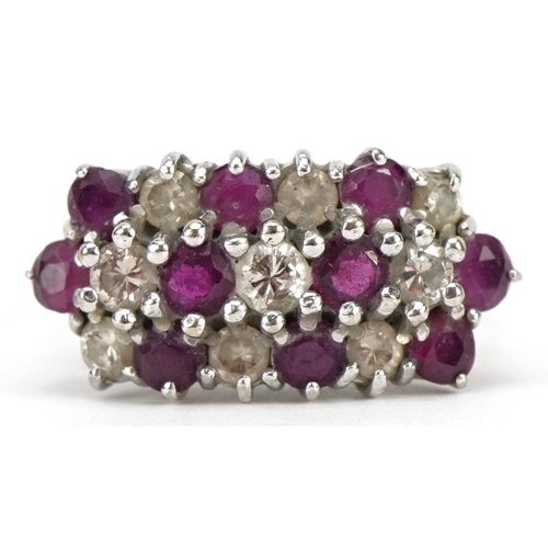 2027 - 18ct white gold diamond and ruby three row cluster ring, the largest diamond and ruby each approxima... 