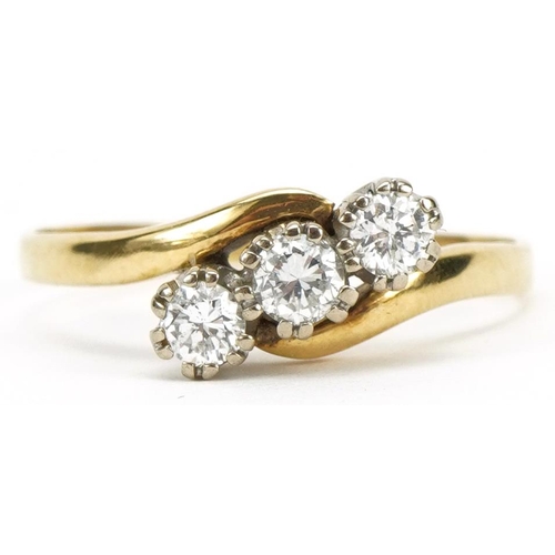 2060 - 18ct gold diamond three stone crossover ring, total diamond weight approximately 0.33 carat, size V,... 