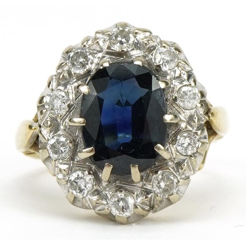 Large 18ct gold sapphire and diamond two tier cluster ring, the sapphire approximately 10.3mm x 7.8mm, each diamond approximately 2.1mm in diameter, size K, 8.3g