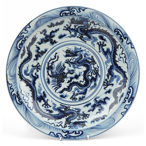 9 - Chinese blue and white porcelain charger hand painted with dragons amongst clouds, character marks t... 