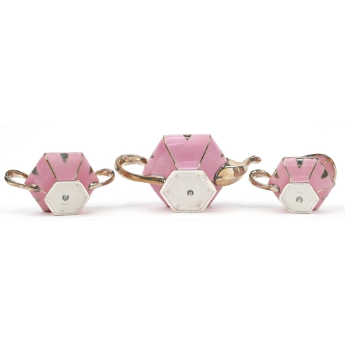 311 - Lenox, American pink glazed porcelain three piece tea set with silver floral overlay comprising teap... 