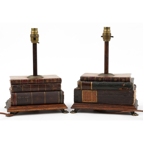 235 - Matched pair of 19th century style stacked book design table lamps with rectangular oak bases on bra... 