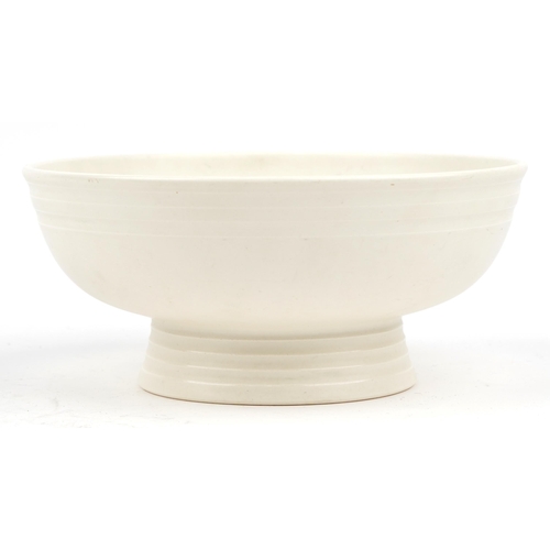 19 - Keith Murray for Wedgwood, studio fruit bowl with ribbed decoration having a white glaze, 26cm  in d... 