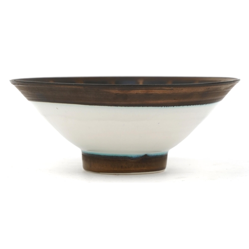 252 - Peter Wills, Raku studio pottery footed bowl, 22cm in diameter