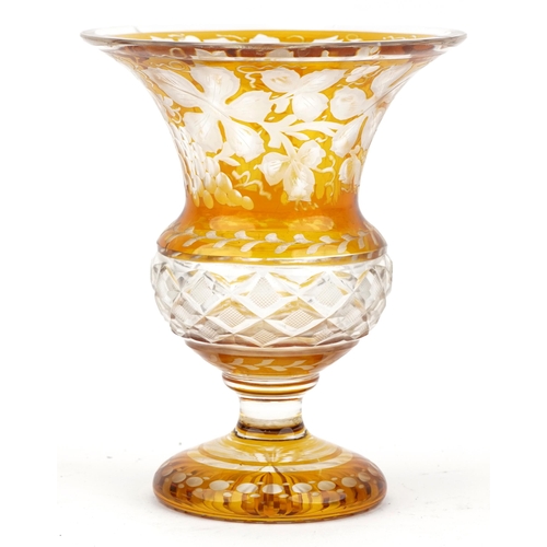 68 - Bohemian amber flashed cut glass vase etched with leaves and berries, 16.5cm high