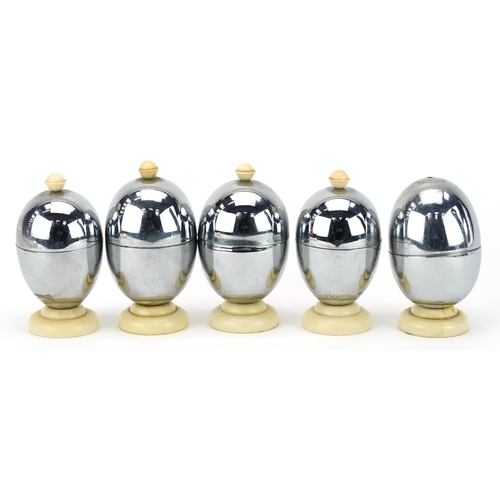 391 - Five vintage Heatmaster egg coddlers, the largest each 10cm high