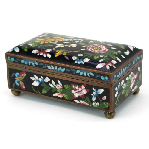 106 - Japanese cloisonne casket enamelled with butterflies amongst flowers, 7.5cm H x 15.5cm D x 9cm D