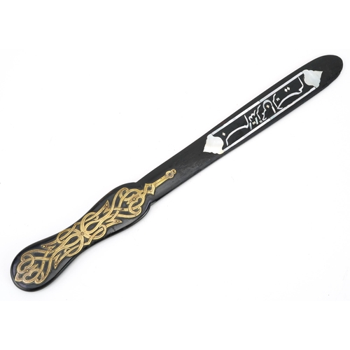 175 - Islamic ebonised Quran opener with mother of pearl inlay decorated with calligraphy, 37cm in length