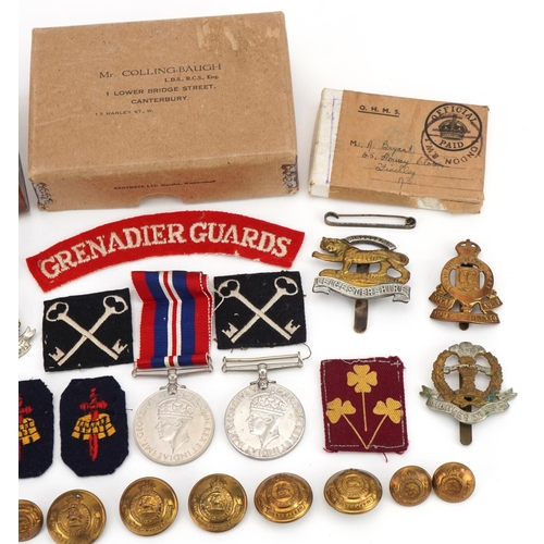 1727 - Militaria including World War II medal with box of issue, Grenadier Guards shoulder title, cap badge... 