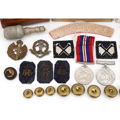 1727 - Militaria including World War II medal with box of issue, Grenadier Guards shoulder title, cap badge... 