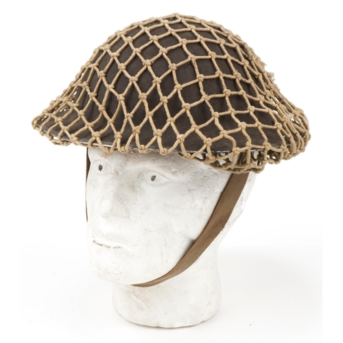 1743 - Military interest tin helmet with liner and netting