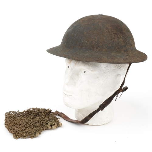 1742 - Military interest tin helmet with liner and netting