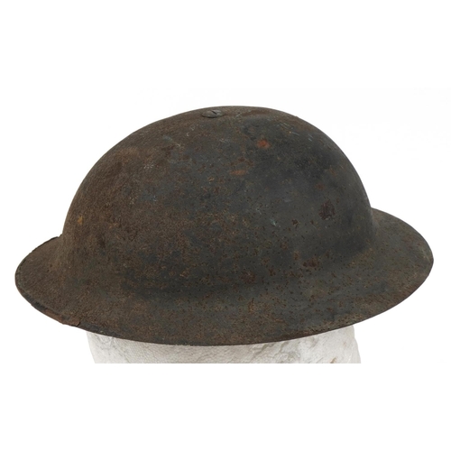 1742 - Military interest tin helmet with liner and netting