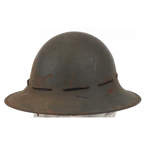 1744 - Military interest tin helmet with lining