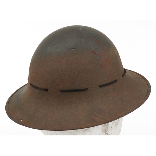 1744 - Military interest tin helmet with lining