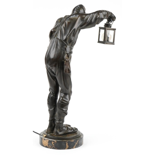 128 - Franz Bernauer, early 20th century patinated bronze lamp in the form of a night watchman holding a l... 