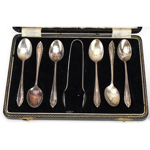 516A - Set of six silver teaspoons and matching sugar tongs and a set of six silver coffee bean spoons, eac... 