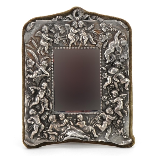 1370 - Pewter mounted easel mirror decorated in relief with a maiden, Putti and flowers, 27cm x 22cm