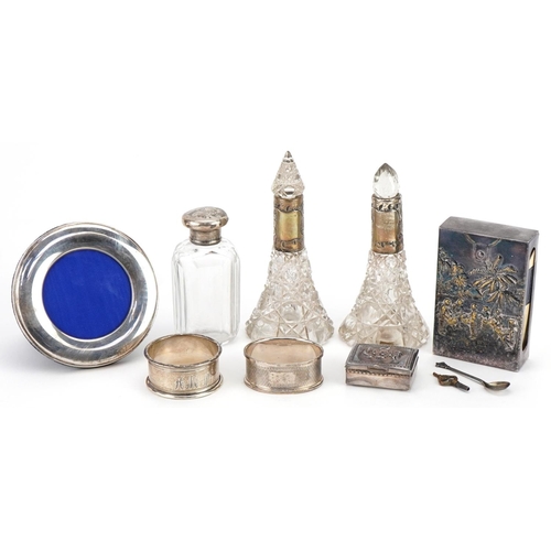 517 - Silver and white metal objects including a pair of cut glass scent bottles with silver collars, circ... 