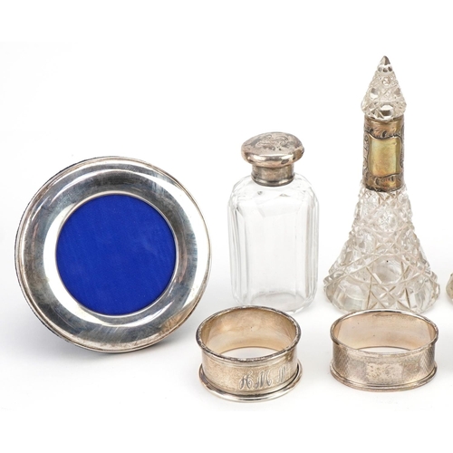 517 - Silver and white metal objects including a pair of cut glass scent bottles with silver collars, circ... 