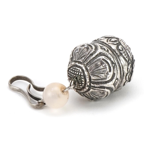 110 - Chinese unmarked silver toggle in the form of a mythical animal with jade bead, 9.5cm high, 22.6g