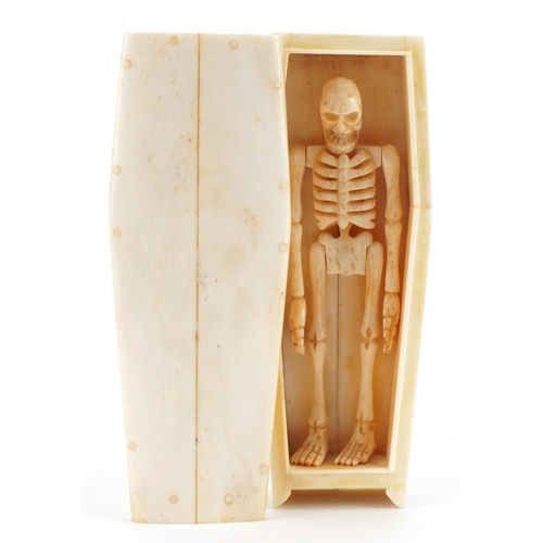 188 - Carved bone articulated skeleton housed in a coffin, inscribed to the base of the coffin, the skelet... 