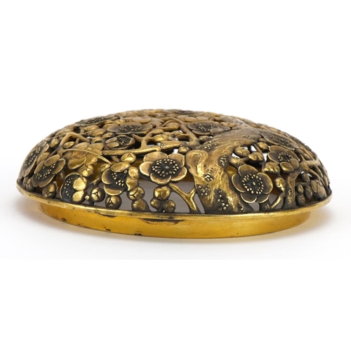 334 - Chinese gilt bronze censer lid finely pierced with peony blossom, 11cm in diameter