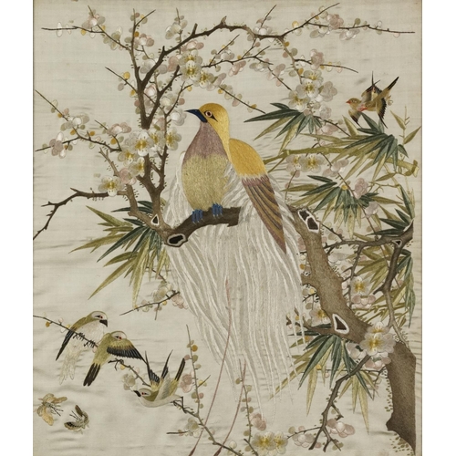 220 - Birds of paradise amongst blossom trees, pair of Chinese silk embroideries, each framed, the largest... 