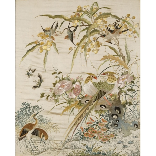 220 - Birds of paradise amongst blossom trees, pair of Chinese silk embroideries, each framed, the largest... 