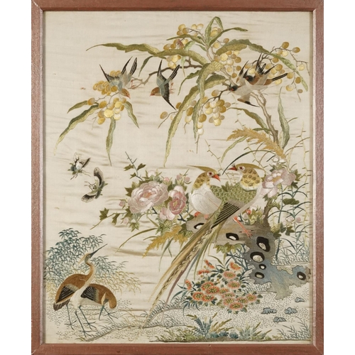 220 - Birds of paradise amongst blossom trees, pair of Chinese silk embroideries, each framed, the largest... 