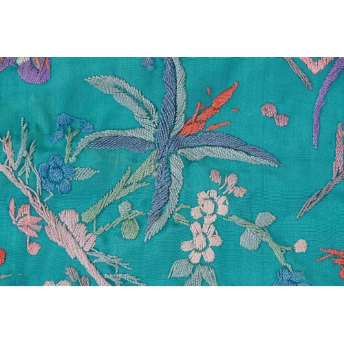 205 - Chinese silk piano shawl embroidered with pagodas, figures and flowers, 120cm x 100cm