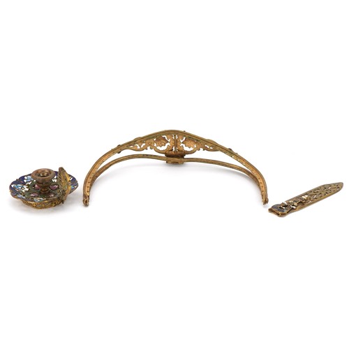 125 - French brass and champleve enamel comprising a chamberstick, handle and foliate bookmark, the larges... 