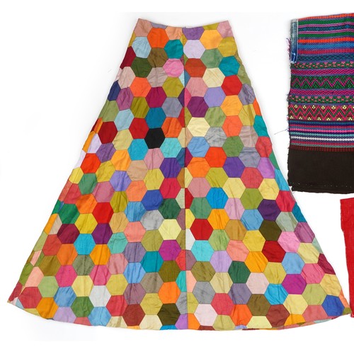 207 - Vintage hexagonal patchwork skirt, patterned Hungarian poncho and one other, the largest 103cm in le... 