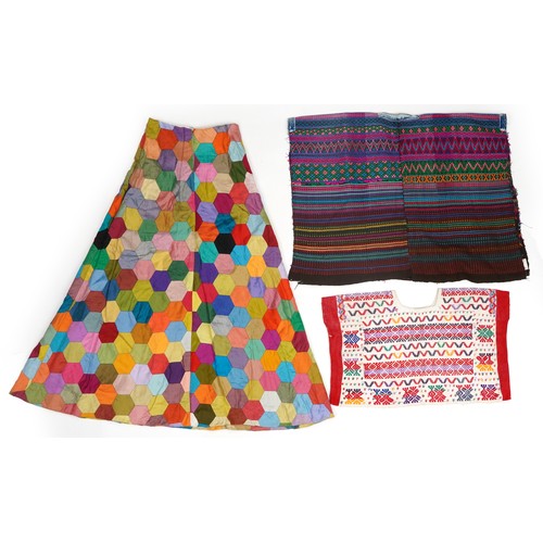 207 - Vintage hexagonal patchwork skirt, patterned Hungarian poncho and one other, the largest 103cm in le... 