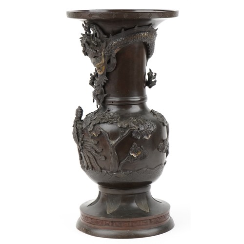 282 - Large Japanese patinated bronze vase decorated in relief with a dragon and phoenix amongst trees, 56... 