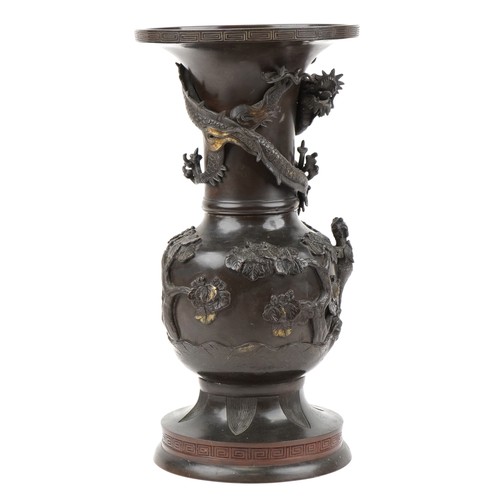 282 - Large Japanese patinated bronze vase decorated in relief with a dragon and phoenix amongst trees, 56... 