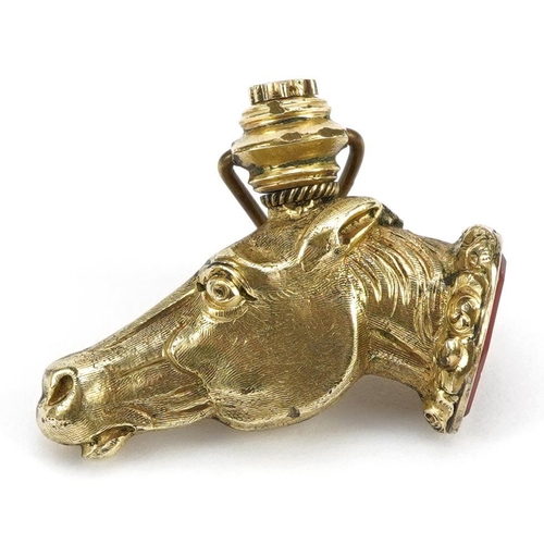 2022 - Unmarked yellow metal intaglio seal fob in the form of a horse head, 3cm in length, 5.8g