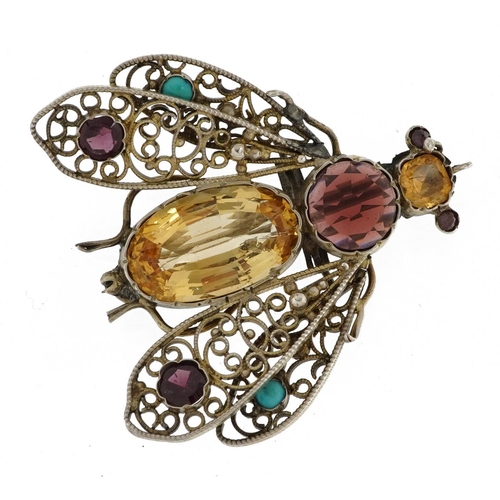2036 - Unmarked silver filigree fly brooch set with semi precious stones including garnet, yellow topaz and... 