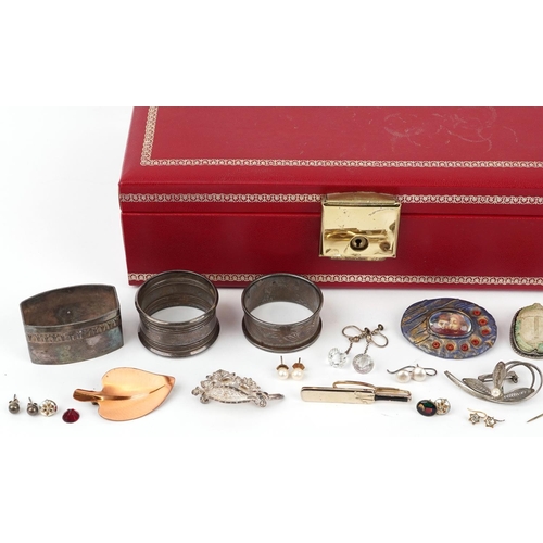 2588 - Antique and later jewellery and objects including silver napkin rings, garnet earrings, silver brooc... 