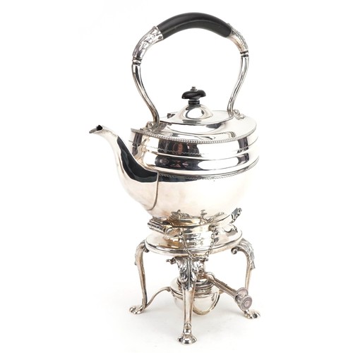 1 - Goldsmiths & Silversmiths Company Ltd, George V silver teapot with ebonised handle on stand with bur... 
