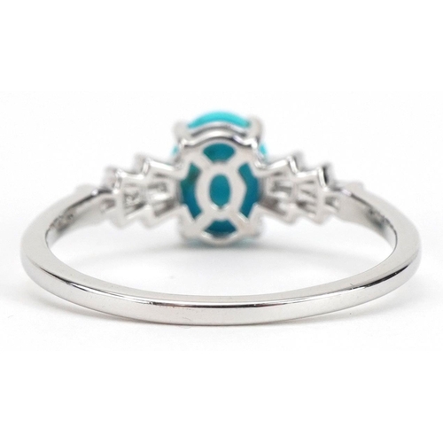 2055 - 9k white gold turquoise cluster solitaire ring with baguette cut diamond shoulders, the turquoise ap... 