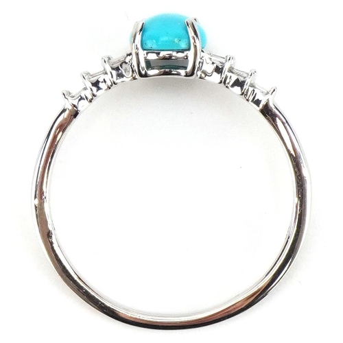 2055 - 9k white gold turquoise cluster solitaire ring with baguette cut diamond shoulders, the turquoise ap... 