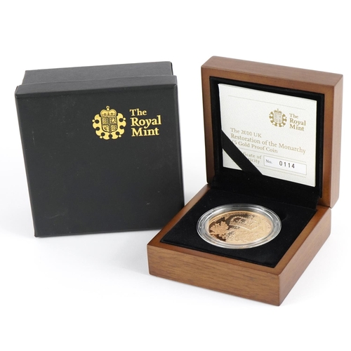 140 - Elizabeth II 2010 Restoration of the Monarchy five pound gold proof coin with fitted case, box and c... 