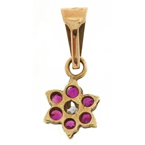 2247 - Unmarked gold diamond and ruby flower head pendant, 1.4cm high, 0.3g