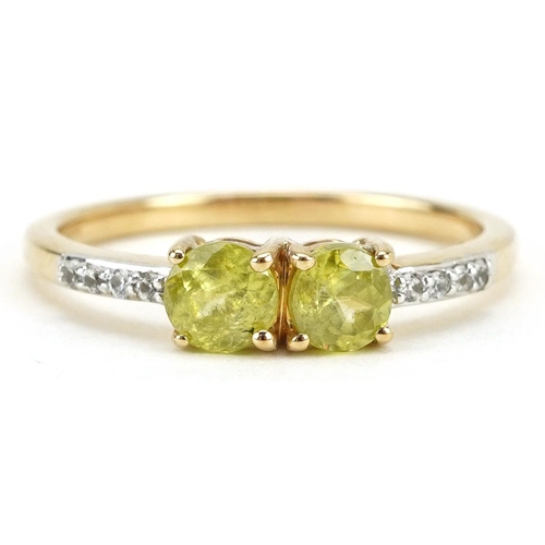 2309 - 9ct gold peridot two stone ring with clear stone set shoulders, each peridot approximately 4.3mm in ... 