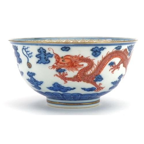 277 - Chinese blue and white with iron red porcelain bowl hand painted with two dragons chasing the flamin... 